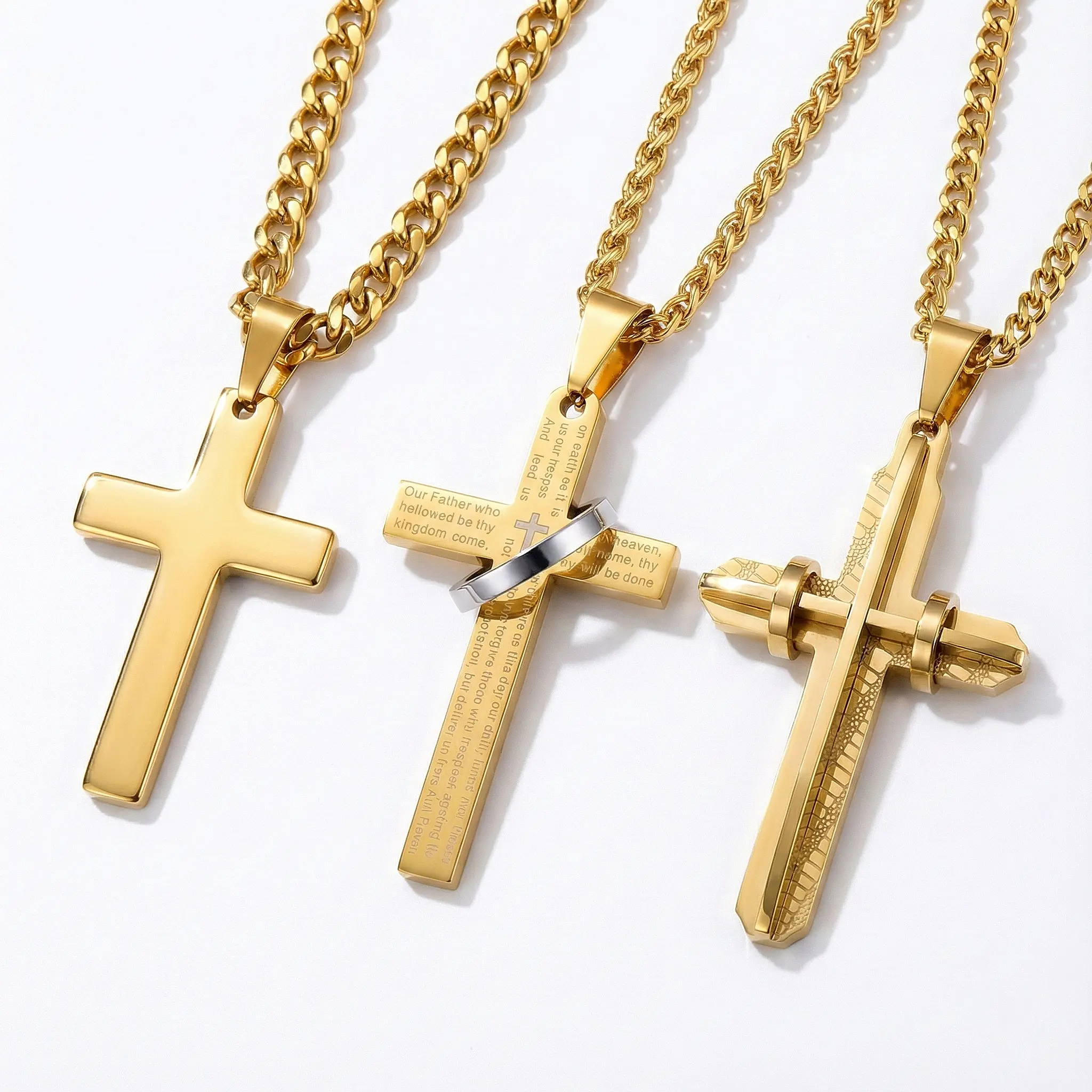 Trio of men's gold-plated cross necklaces: Polished minimalist cross on Cuban Link chain, Lord's Prayer engraved cross with silver ring accent, and textured architectural cross pendant.
