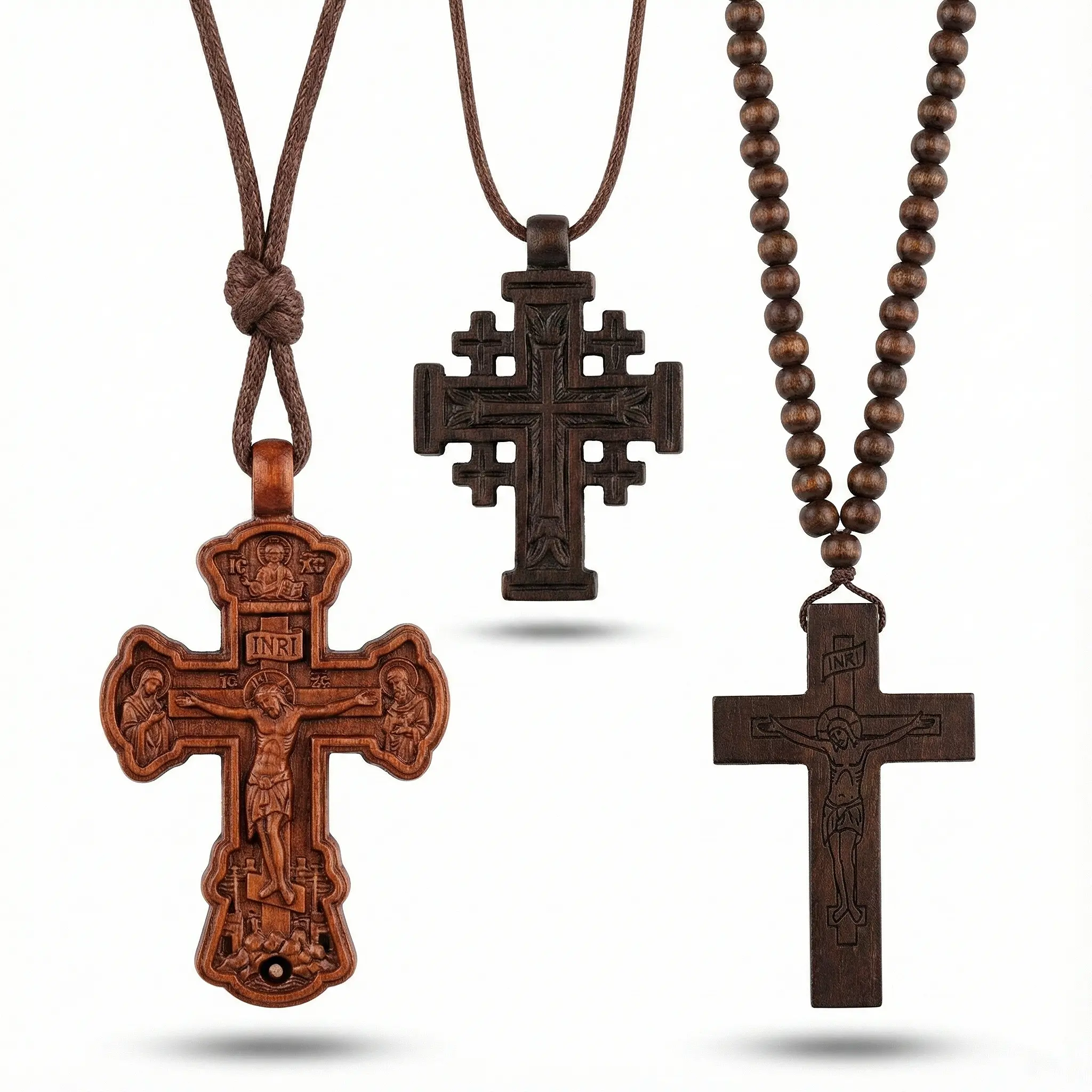 Trio of natural wooden cross necklaces: Detailed hand-carved style crucifix with INRI on cord, geometric Jerusalem cross, and dark wood cross on beaded rosary necklace.