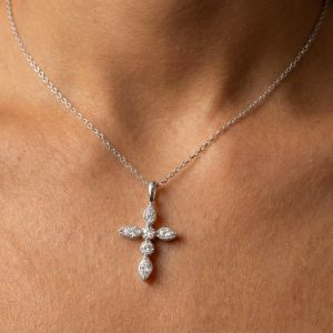 Small Diamond Cross Necklace in Silver worn by a woman