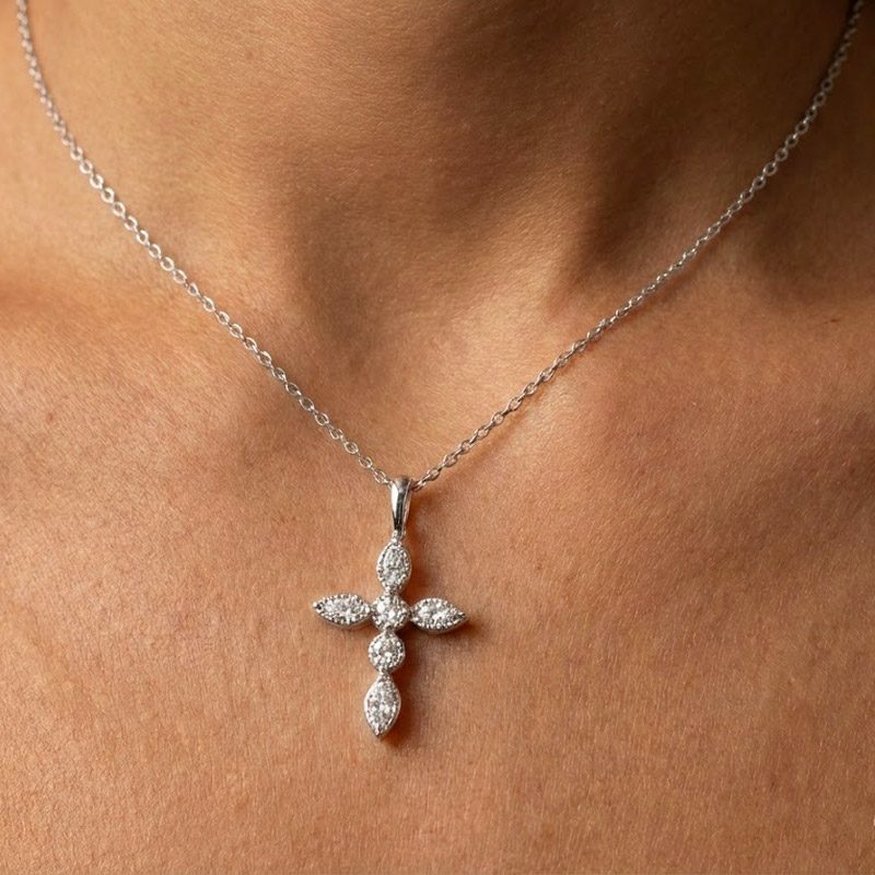 small diamond cross necklace silver Small Diamond Cross Necklace in Silver worn by a woman