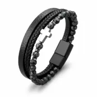 Four-strand faux leather cross bracelet with black magnetic clasp and gray stone beads, white background