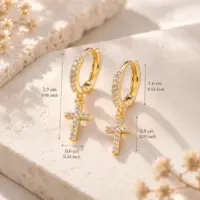 Gold cross huggie earrings marked with hoop, drop and cross sizes on stone