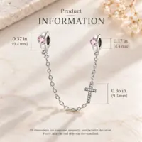 Stopper bead and cross sizes marked on the safety chain against pale marble