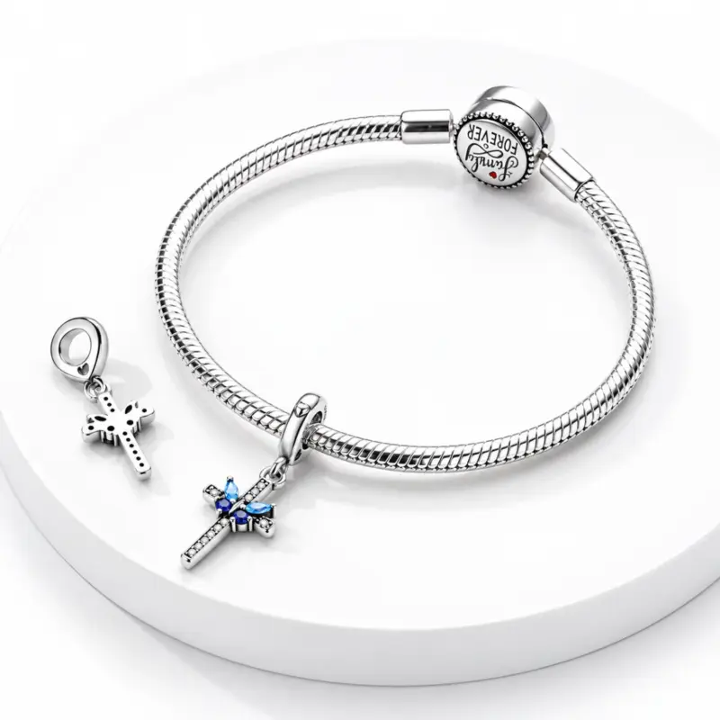 butterfly cross charm psyche Blue butterfly cross dangle on a snake chain bracelet, second charm showing its open reverse