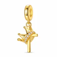 Gold-plated crown and cross dangle charm with clear stones, angled view on white background