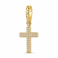 CZ pavé Latin cross in 14k gold plating, hanging from a puffed-heart bail