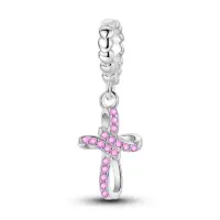 Pink pavé cross charm in sterling silver with an open ribbon loop and beaded bail