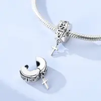 Men's silver cross charm clipped onto a snake chain bracelet, front view
