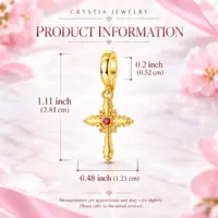 Dimensions of the scrolled gold cross charm, 1.11 in tall, shown on pink marble