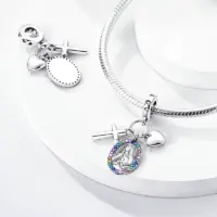 Marian charm shown front and blank reverse beside a snake chain bracelet