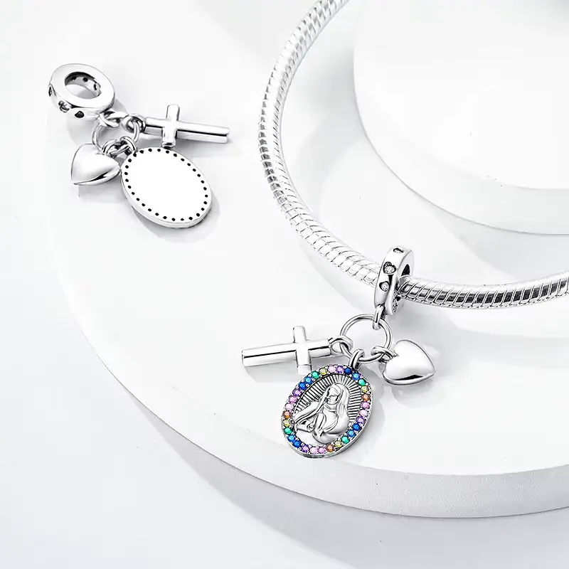 virgin mary charm tepeyac Marian charm shown front and blank reverse beside a snake chain bracelet