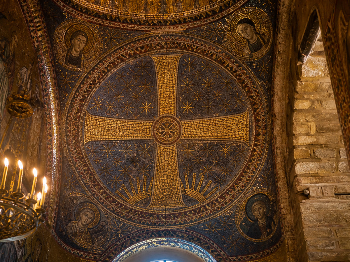 Byzantine gold and blue mosaic of a Greek cross in an ancient Eastern Orthodox church