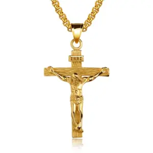 Gold crucifix necklace with INRI titulus and textured cross arms on a box chain