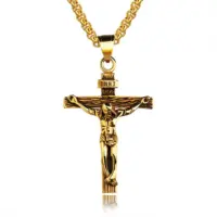 Antique gold crucifix pendant with INRI titulus on a gold box chain, white background