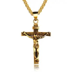 Antique gold crucifix pendant with INRI titulus on a gold box chain, white background