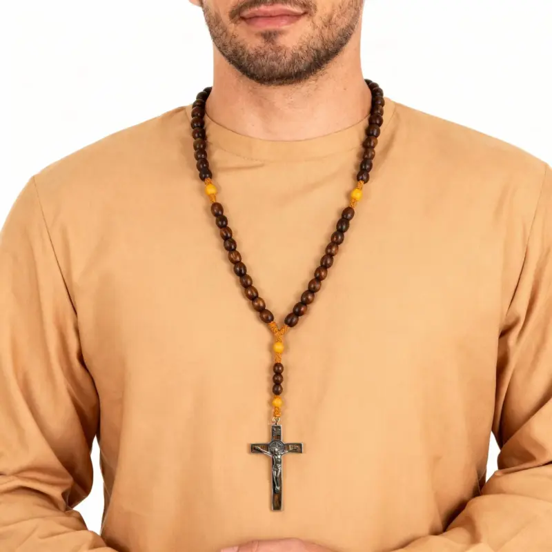 mens-tiger-eye-cross-necklace-worn Man wearing a tiger eye beaded necklace with silver cross pendant