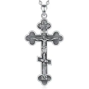 Sterling silver Russian Orthodox crucifix pendant on a fine cable chain, white background