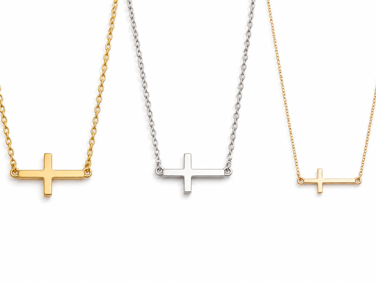 Three different sideways cross necklace styles on a white background